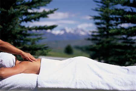 full body massage - Woman Lying Outdoors, Having Back Massaged Foto de stock - Con derechos protegidos, Código: 700-00067941