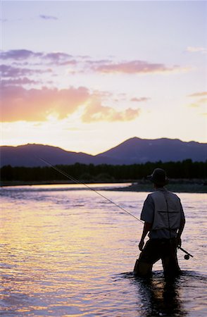 simsearch:700-00055321,k - Rückansicht des Mannes Fliegenfischen bei Sonnenuntergang, Wyoming, USA Stockbilder - Lizenzpflichtiges, Bildnummer: 700-00067974