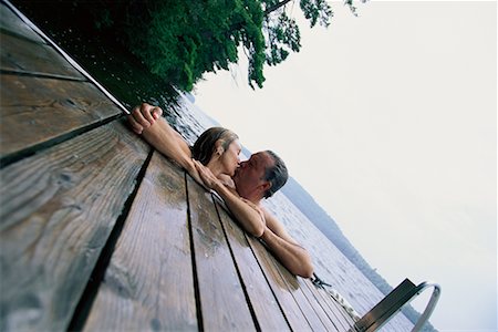 simsearch:700-00053794,k - Mature Couple in Lake, Leaning on Dock, Kissing Stock Photo - Rights-Managed, Code: 700-00068246