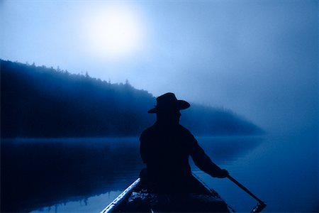 Silhouette of Person Canoeing in Fog, Stuart River British Columbia, Canada Stock Photo - Rights-Managed, Code: 700-00068351