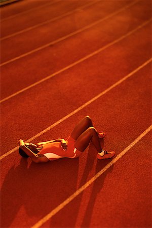 peter griffith - Female Athlete Lying on Track Stock Photo - Rights-Managed, Code: 700-00068435