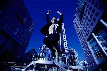 ecstatic man canada - Ecstatic Businessman Jumping in Air, Toronto, Ontario, Canada Stock Photo - Rights-Managed, Code: 700-00068438
