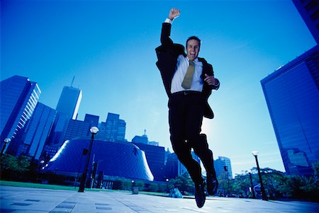 ecstatic man canada - Ecstatic Businessman Jumping in Air, Toronto, Ontario, Canada Stock Photo - Rights-Managed, Code: 700-00068439