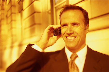 simsearch:700-00043555,k - Businessman Using Cell Phone Outdoors Stock Photo - Rights-Managed, Code: 700-00068446