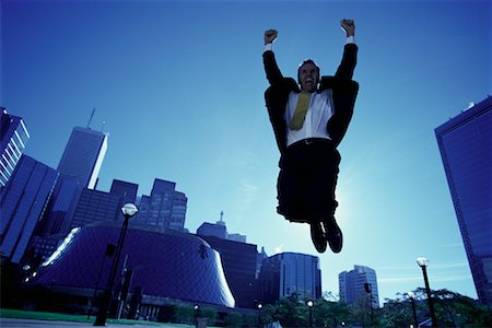 ecstatic man canada - Ecstatic Businessman Jumping in Air, Toronto, Ontario, Canada Stock Photo - Rights-Managed, Code: 700-00068440