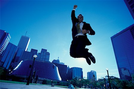 ecstatic man canada - Ecstatic Businessman Jumping in Air, Toronto, Ontario, Canada Stock Photo - Rights-Managed, Code: 700-00068441
