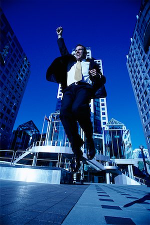 ecstatic man canada - Ecstatic Businessman Jumping in Air, Toronto, Ontario, Canada Stock Photo - Rights-Managed, Code: 700-00068526