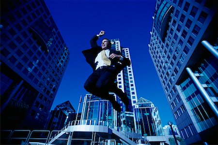 ecstatic man canada - Ecstatic Businessman Jumping in Air, Toronto, Ontario, Canada Stock Photo - Rights-Managed, Code: 700-00068527