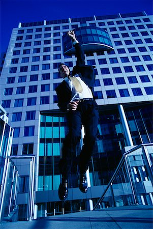 ecstatic man canada - Ecstatic Businessman Jumping in Air, Toronto, Ontario, Canada Stock Photo - Rights-Managed, Code: 700-00068523