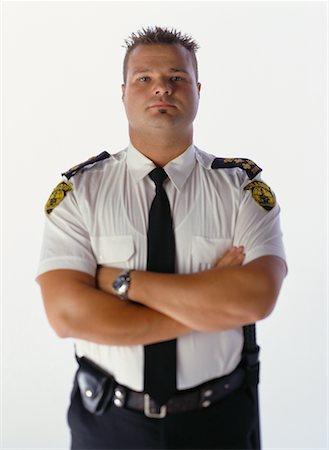 fat men in uniform - Portrait of Male Security Guard With Arms Crossed Stock Photo - Rights-Managed, Code: 700-00068599