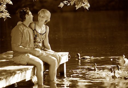Couple Sitting on Dock, Talking Stock Photo - Rights-Managed, Code: 700-00068634