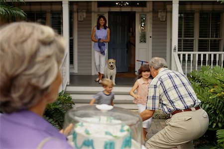 father child yard not illustration not business not vintage not 20s not 30s not 40s not 70s not 80s - Mother and Children Greeting Grandparents at House Stock Photo - Rights-Managed, Code: 700-00068712
