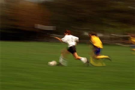 simsearch:700-00087011,k - Blurred View of Girls Playing Soccer Foto de stock - Con derechos protegidos, Código: 700-00068777