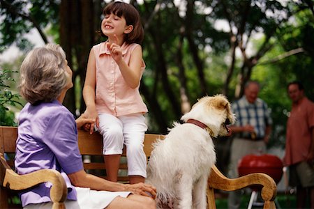 family on picnic with dog - Grandmother and Granddaughter Sitting on Bench with Dog Stock Photo - Rights-Managed, Code: 700-00068954