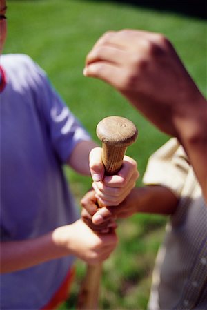 Close-Up of Children's Hands on Baseball Bat Stock Photo - Rights-Managed, Code: 700-00069317