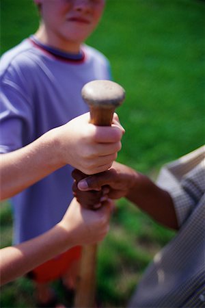 Close-Up of Children Holding Baseball Bat Stock Photo - Rights-Managed, Code: 700-00069318