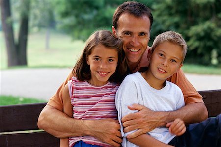 portrait of family on park bench - Portrait of Father, Son and Daughter Outdoors, Toronto, ON Canada Stock Photo - Rights-Managed, Code: 700-00069470
