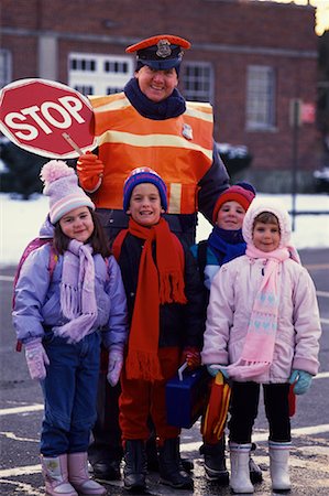 Portrait of Children Standing on Street with Crossing Guard Stock Photo - Rights-Managed, Code: 700-00069548