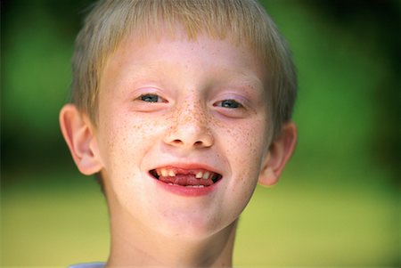 Portrait of Boy with Missing Teeth Foto de stock - Con derechos protegidos, Código: 700-00069552