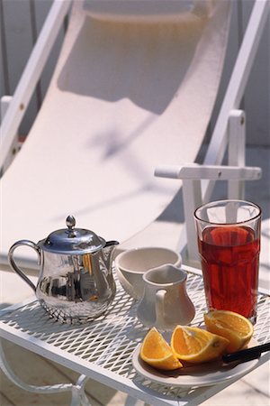 Breakfast Setting on Table near Deck Chair Outdoors Stock Photo - Rights-Managed, Code: 700-00069569