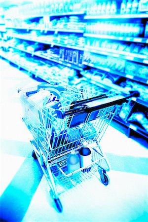 Packed Shopping Cart in Supermarket Aisle Stock Photo - Rights-Managed, Code: 700-00069689