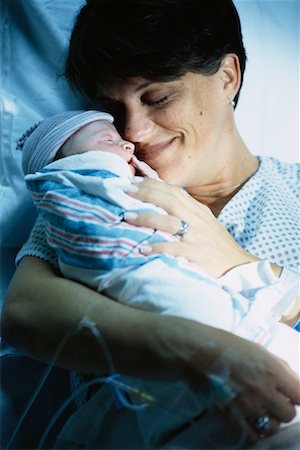 Mother Holding Newborn Baby in Hospital Stock Photo - Rights-Managed, Code: 700-00069784