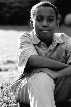 Portrait of Boy Sitting Outdoors Stock Photo - Rights-Managed, Code: 700-00069959