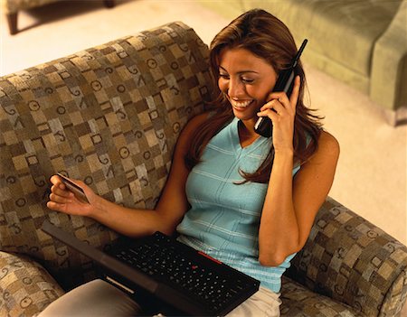simsearch:700-00280412,k - Woman Sitting in Chair with Laptop, Phone and Credit Card Stock Photo - Rights-Managed, Code: 700-00060048