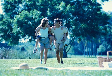 family picnics play - Mother and Father Carrying Son And Daughter on Backs Outdoors Stock Photo - Rights-Managed, Code: 700-00060127