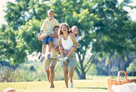 family picnics play - Mother and Father Carrying Son And Daughter Outdoors Stock Photo - Rights-Managed, Code: 700-00060129