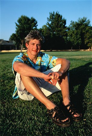 person in hawaiian shirt - Portrait of Young Man Sitting in Field Stock Photo - Rights-Managed, Code: 700-00060190