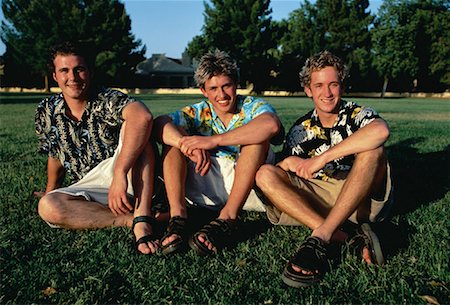 person in hawaiian shirt - Portrait of Three Young Men Sitting in Field Stock Photo - Rights-Managed, Code: 700-00060191