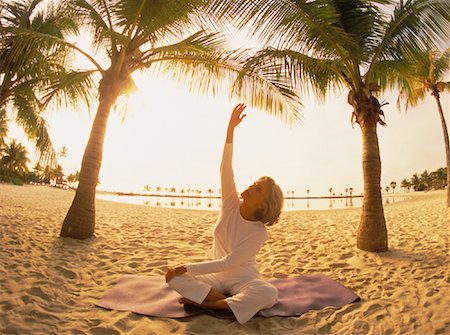senior women stretching on beach - Mature Woman Practising Yoga on Beach at Sunset, Florida, USA Stock Photo - Rights-Managed, Code: 700-00060296
