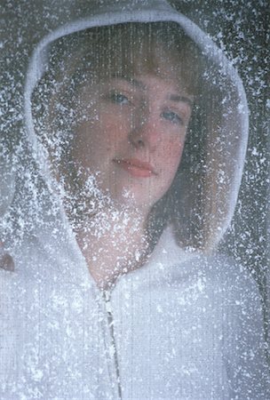 Portrait of Teenage Girl Standing Behind Screen Door with Snow Stock Photo - Rights-Managed, Code: 700-00060489