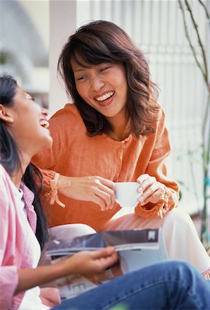 people laughing magazine - Two Women with Magazine and Cup Laughing Stock Photo - Rights-Managed, Code: 700-00060523