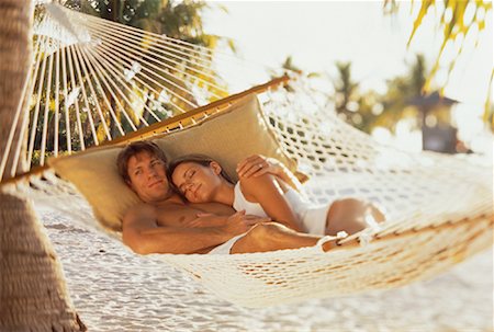 Couple in Swimwear, Relaxing in Hammock on Beach Stock Photo - Rights-Managed, Code: 700-00060558