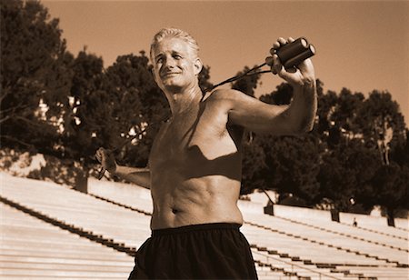 simsearch:700-00060793,k - Mature Man Exercising near Bleachers Stock Photo - Rights-Managed, Code: 700-00060832