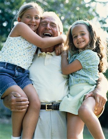 Portrait of Grandfather Holding Granddaughters Outdoors Stock Photo - Rights-Managed, Code: 700-00060937