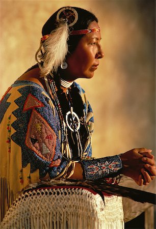 pictures north american indians traditional costumes - Profile of Native American Sioux Woman Sitting Outdoors, NM, USA Stock Photo - Rights-Managed, Code: 700-00061054