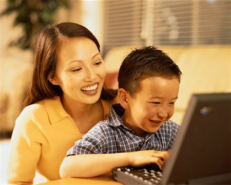 Mother and Son Using Laptop Computer, Smiling Stock Photo - Rights-Managed, Code: 700-00061188