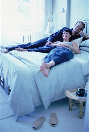Couple Relaxing on Bed Stock Photo - Rights-Managed, Code: 700-00061350