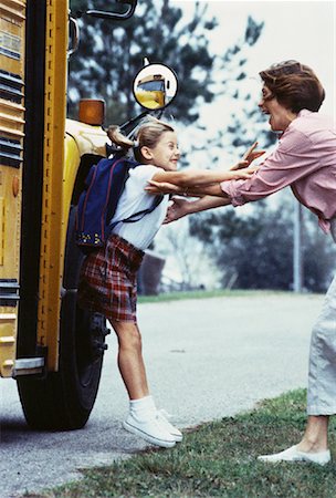 Daughter Running to Mother after Departing from School Bus Stock Photo - Rights-Managed, Code: 700-00061399
