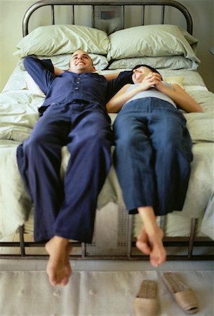 Couple Relaxing on Bed Stock Photo - Rights-Managed, Code: 700-00061405