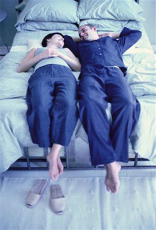 Couple Relaxing on Bed Stock Photo - Rights-Managed, Code: 700-00061406