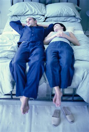 Couple Relaxing on Bed Stock Photo - Rights-Managed, Code: 700-00061430