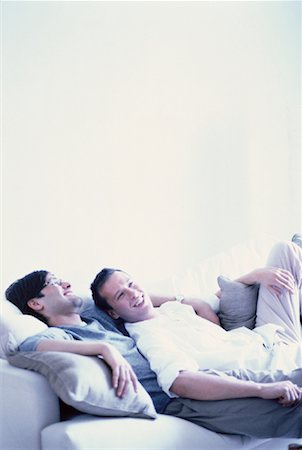 Male Couple Relaxing on Sofa Stock Photo - Rights-Managed, Code: 700-00061445