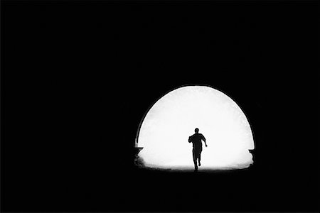 Silhouette of Person Running in Tunnel Foto de stock - Con derechos protegidos, Código: 700-00061473