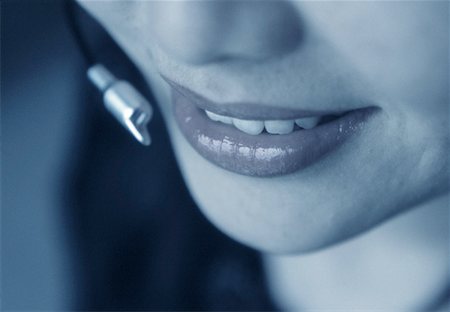 Close-Up of Woman's Mouth and Telephone Headset Stock Photo - Rights-Managed, Code: 700-00061617