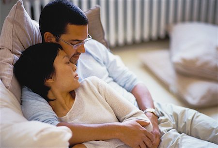 simsearch:640-01355958,k - Couple Relaxing on Sofa Embracing Stock Photo - Rights-Managed, Code: 700-00061640