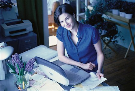 simsearch:700-00062758,k - Portrait of Young Woman Sitting At Desk with Laptop Computer Stock Photo - Rights-Managed, Code: 700-00061650